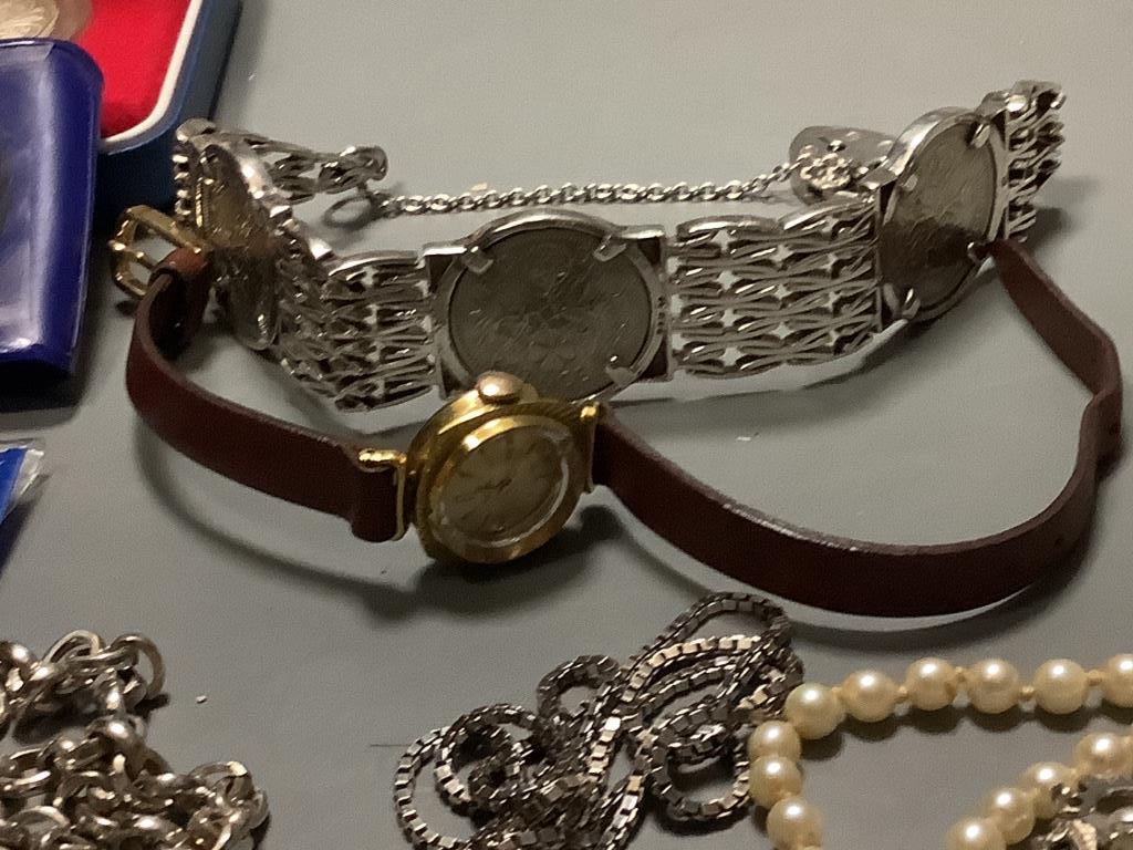 A two-row pearl necklace with 18ct gold gem-set floral clasp, a silver ingot pendant on chain, coin-set silver bracelet and sundries
